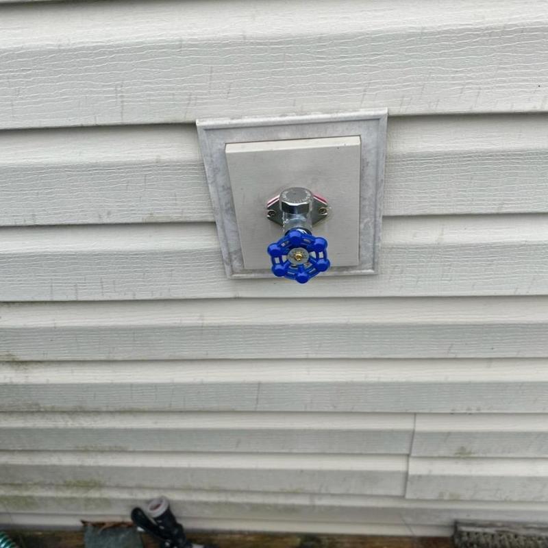Frost-free hose bib installed on house exterior wall