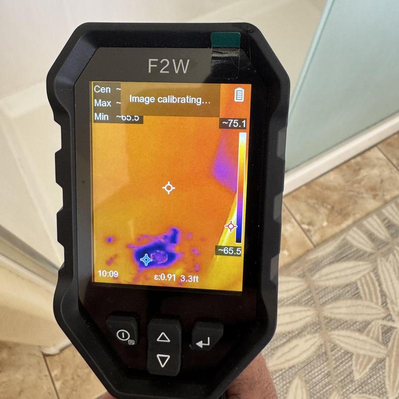 Infrared camera showing moisture detection behind shower wall Infrared camera showing moisture detection behind shower wall