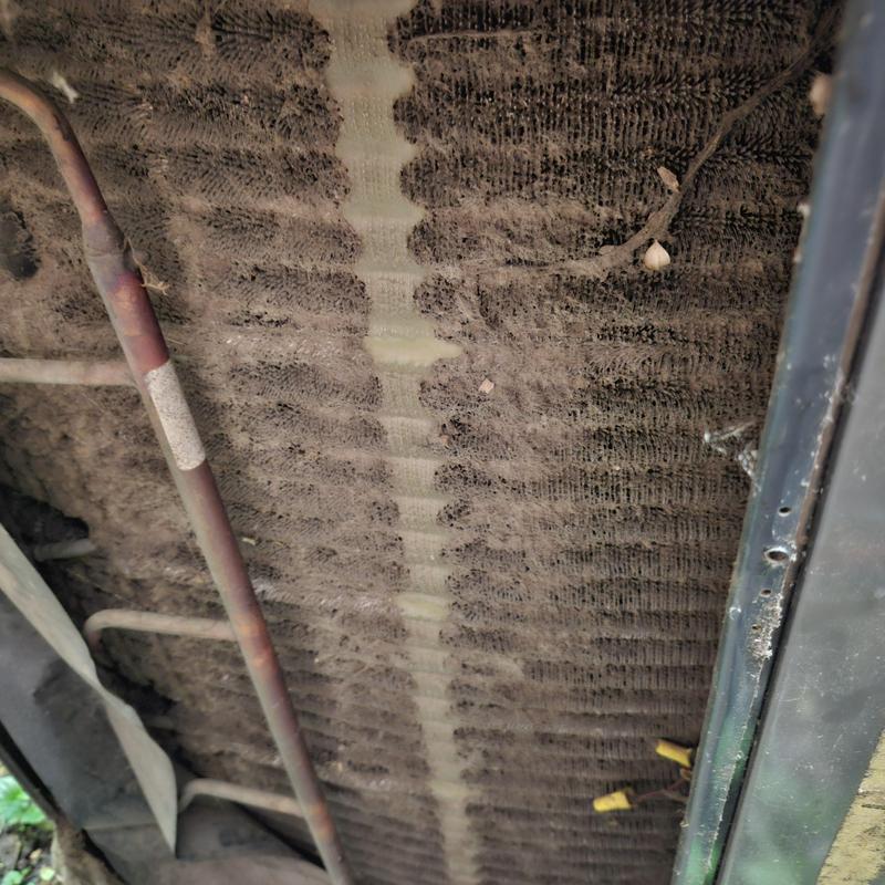 AC unit evaporator coil heavily clogged with dust buildup AC unit evaporator coil heavily clogged with dust buildup