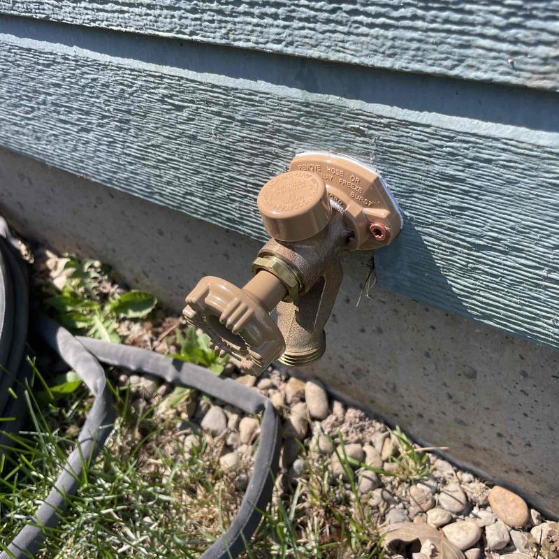 Hose bib installation with new freeze cover outdoors