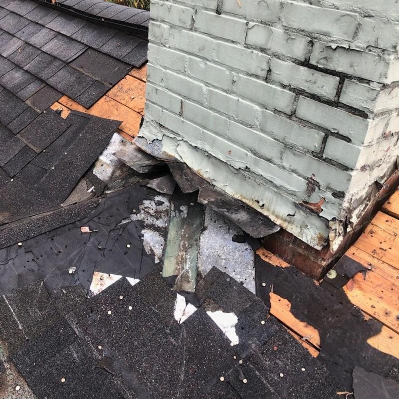 Chimney flashing removal and roof underlayment exposed Chimney flashing removal and roof underlayment exposed