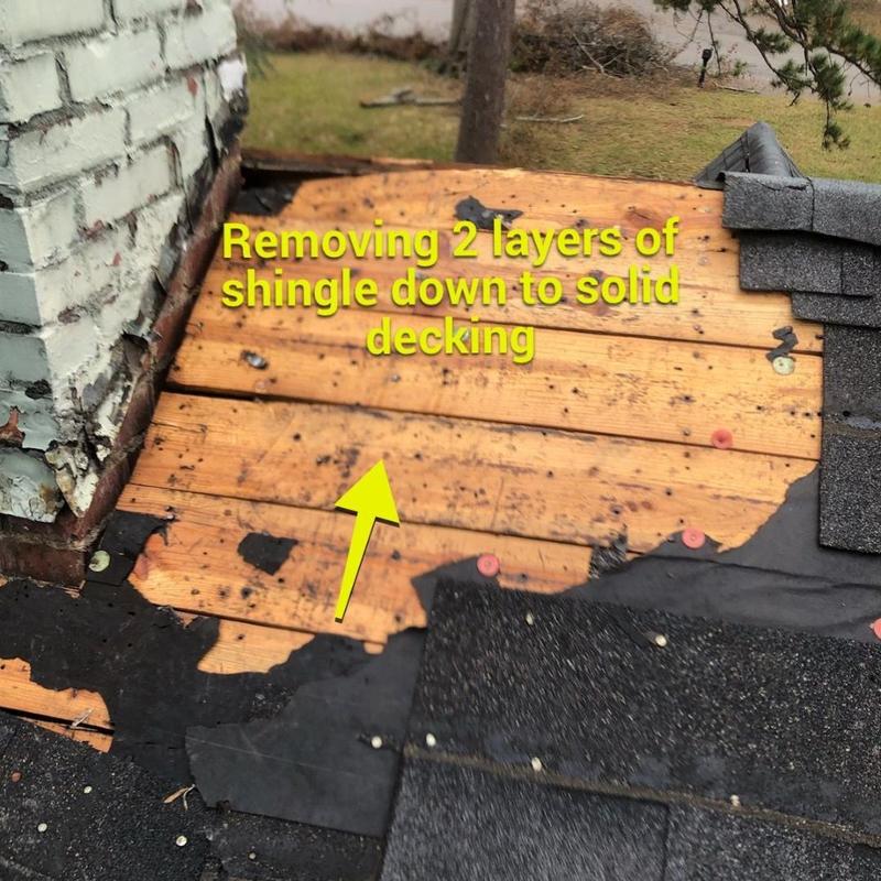 Roof decking exposed after shingle removal near chimney Roof decking exposed after shingle removal near chimney