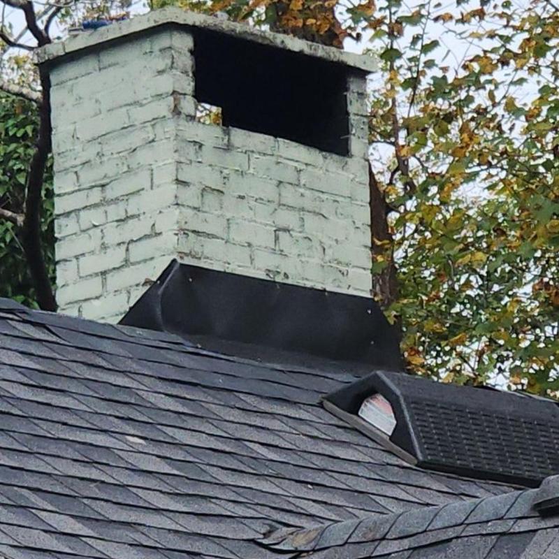 Chimney flashing installation on asphalt shingle roof Chimney flashing installation on asphalt shingle roof