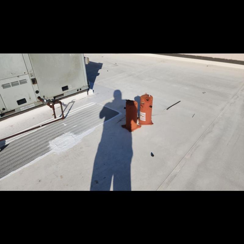 TPO roof patching near HVAC unit on flat roof TPO roof patching near HVAC unit on flat roof