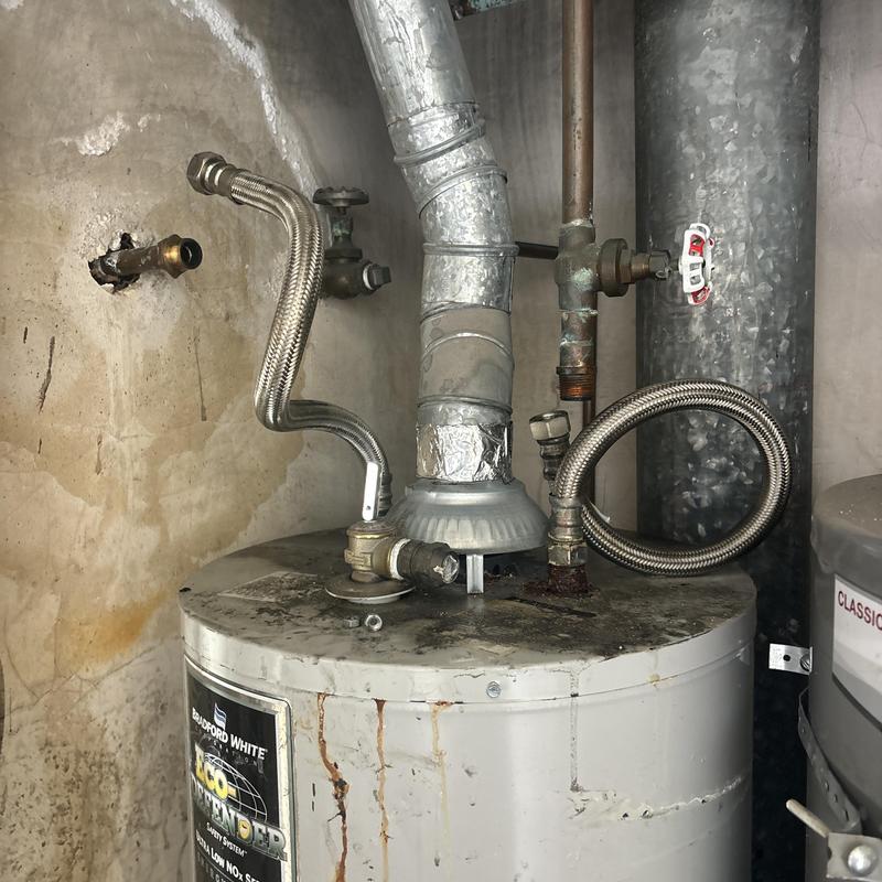 Water heater with gas and water supply lines installed