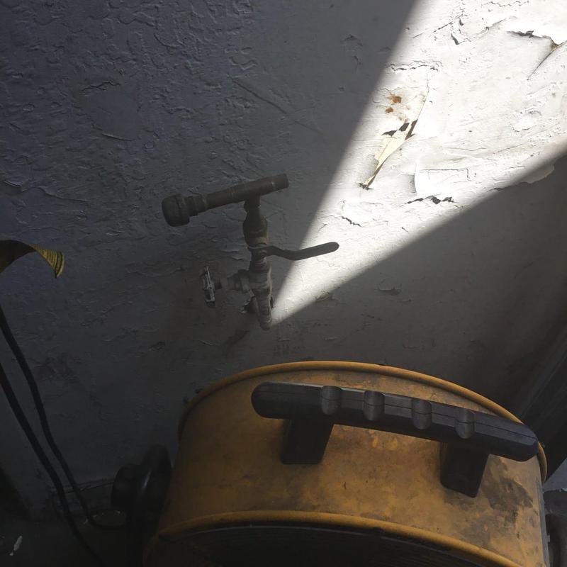 Water spigot installation on textured wall with blower fan