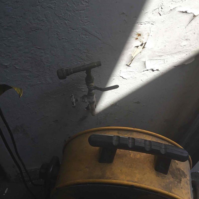 Shop wall water spicket and hose reel setup