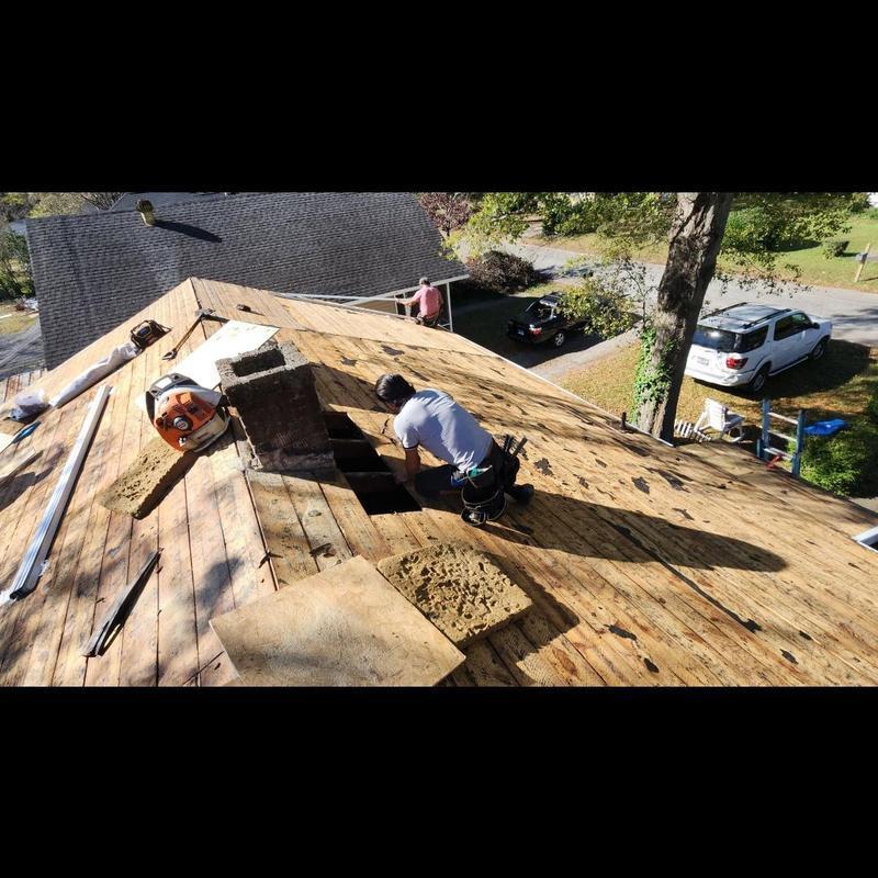 Roof decking wood replacement near chimney on house roof Roof decking wood replacement near chimney on house roof