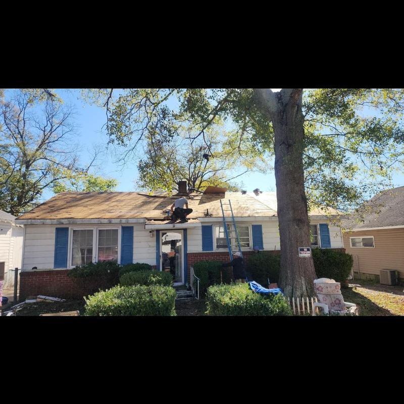 Architectural shingle roof installation on house Architectural shingle roof installation on house