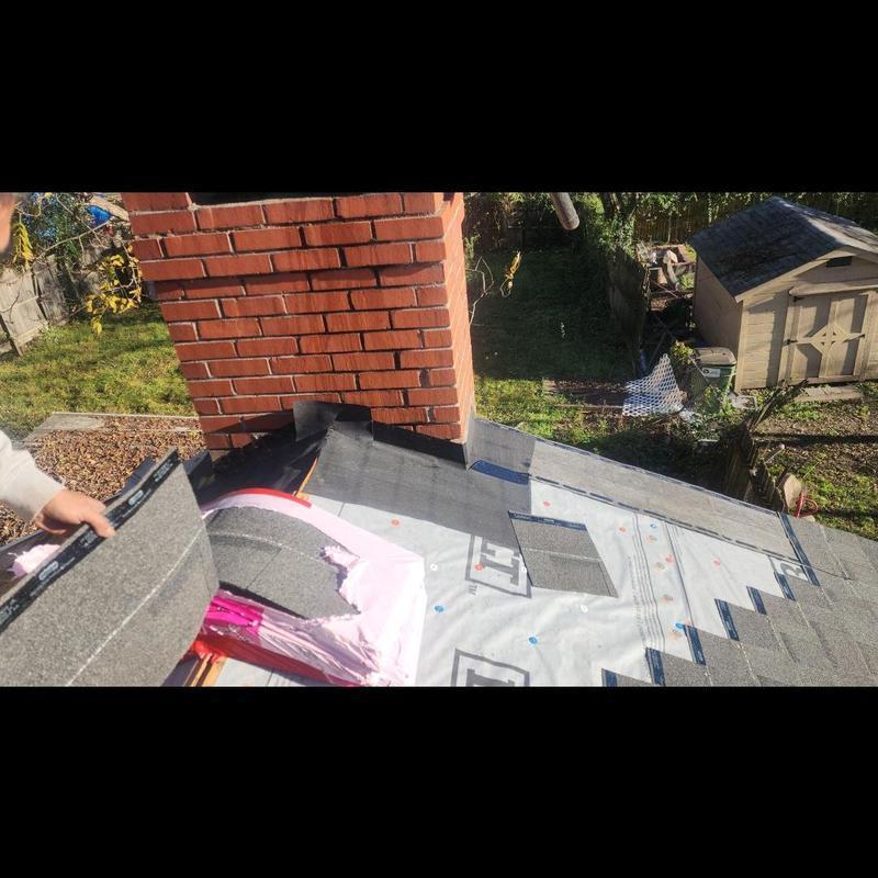 Oak Ridge Estate Gray shingles near brick chimney installation Oak Ridge Estate Gray shingles near brick chimney installation