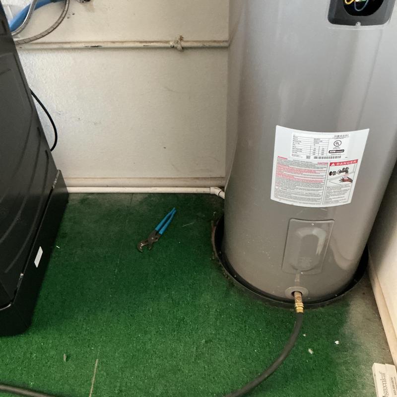 Water heater with drain pan and hose bib connection Water heater with drain pan and hose bib connection