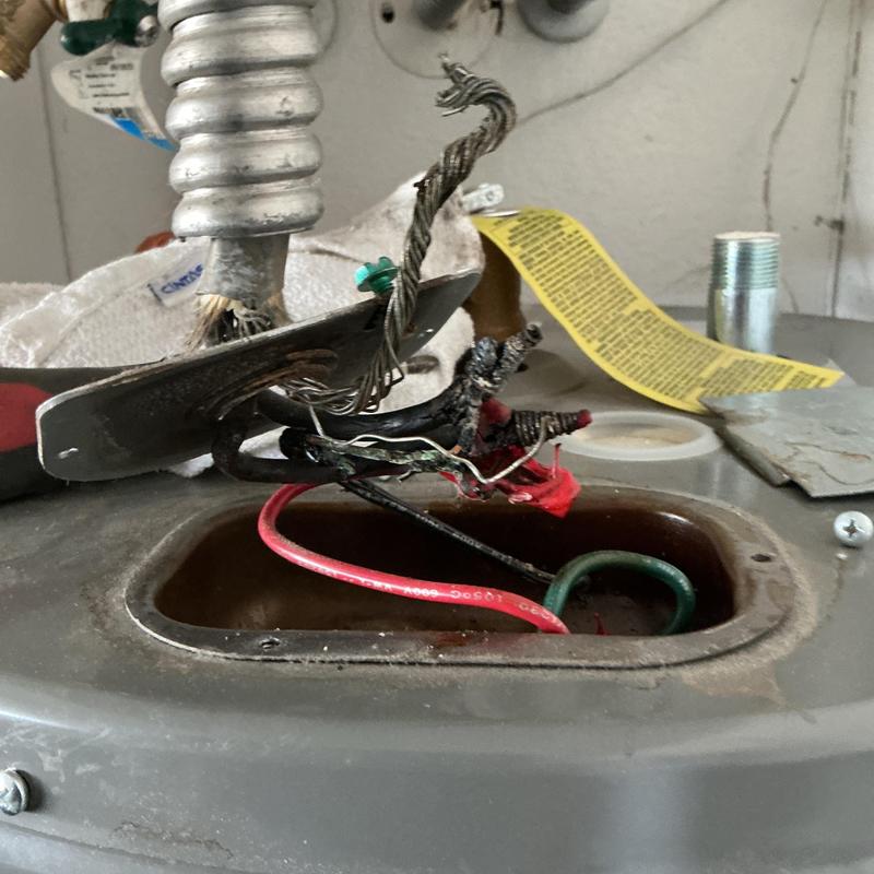 Water heater wiring with electrical disconnect exposed Water heater wiring with electrical disconnect exposed