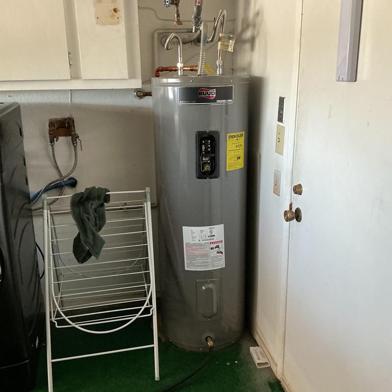 Water heater with electrical disconnect and drain pan Water heater with electrical disconnect and drain pan