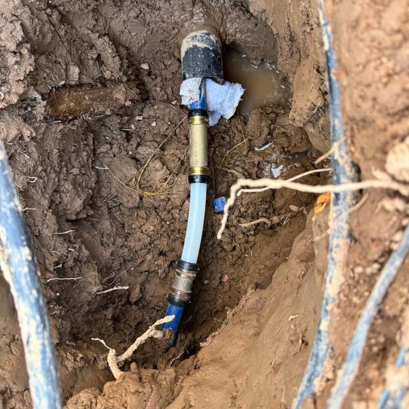 1 1/4 inch PEX water main repair in dirt excavation