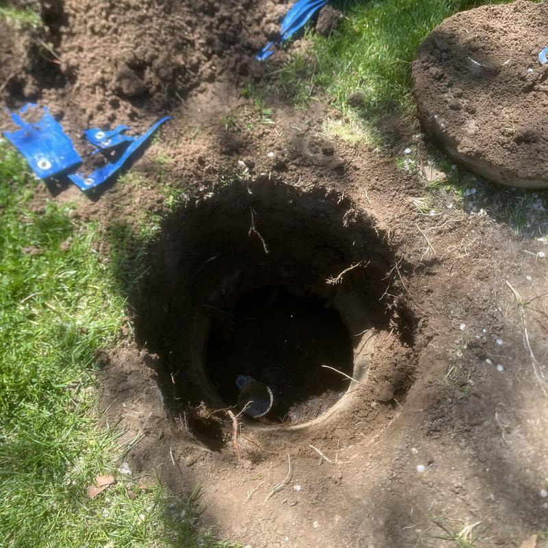 Septic tank opening after pump out in yard dirt