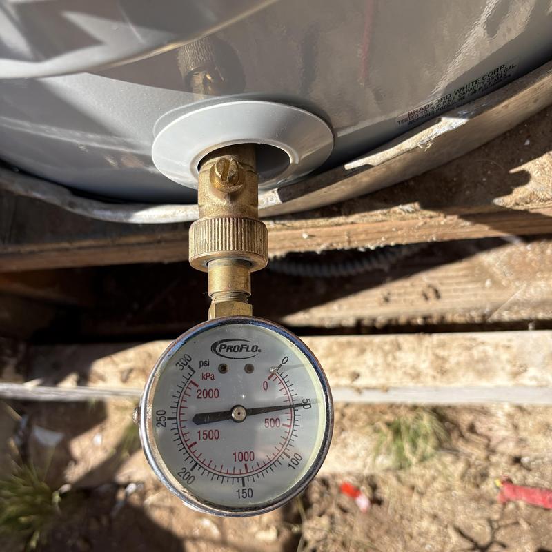 Water heater pressure gauge installed on valve connection
