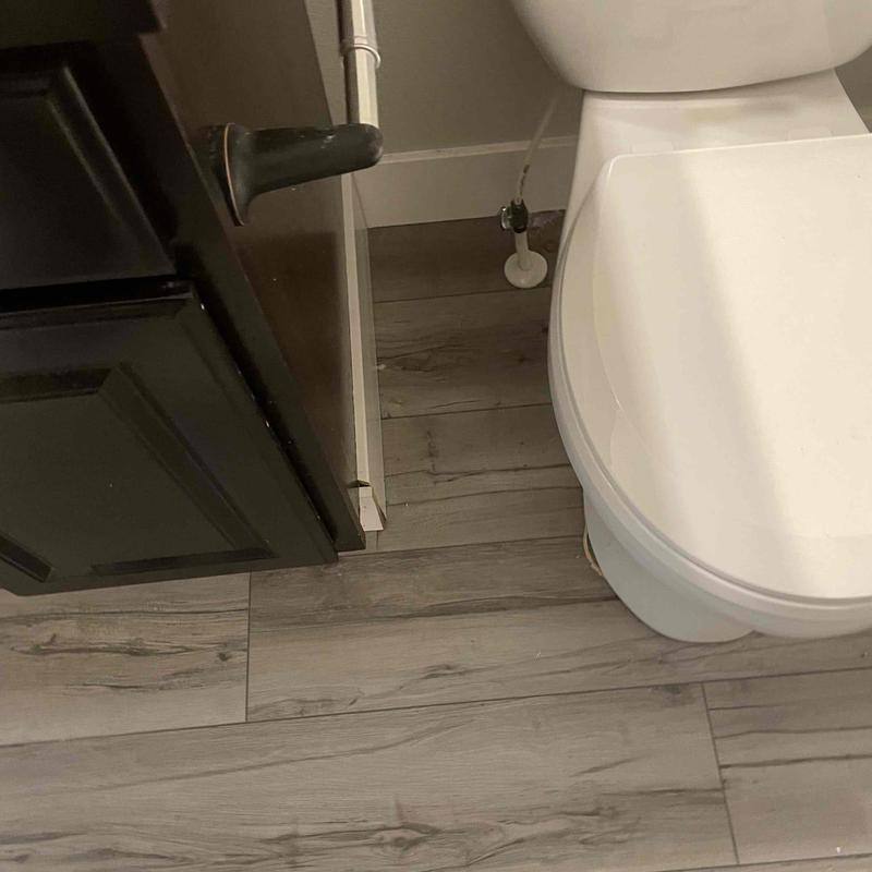 Toilet supply line and bathroom floor plumbing connection