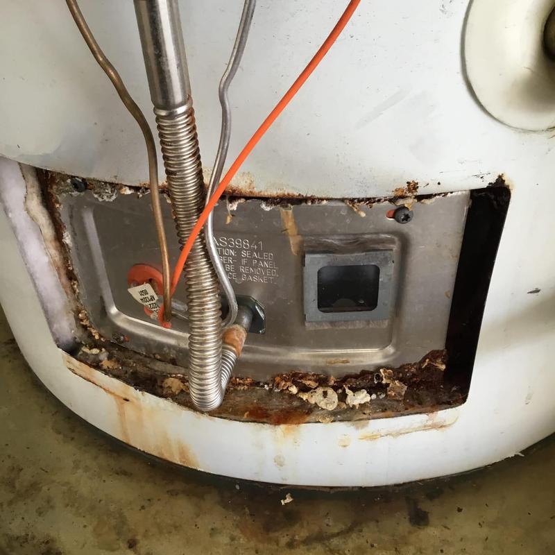 Water heater with corroded base and old supply lines