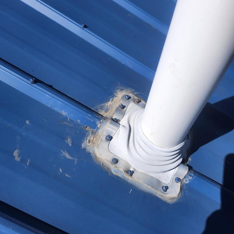 Vent pipe boot on metal roof with sealant applied Vent pipe boot on metal roof with sealant applied