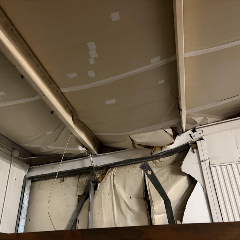 Metal building interior wall and ceiling damage