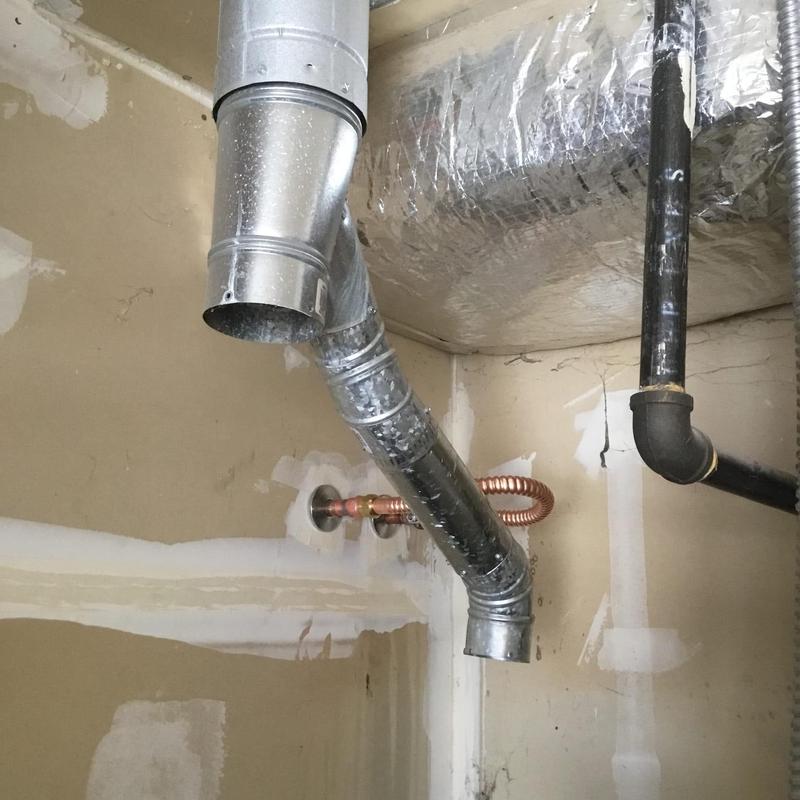 Water heater ventilation pipe and copper gas line installation