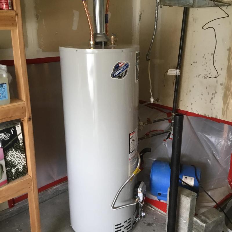 Water heater installation with temporary connections in garage