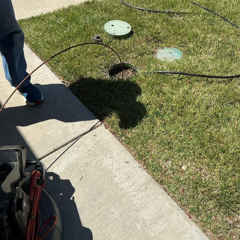 Main sewer line hydro-jetting with root intrusion clearing