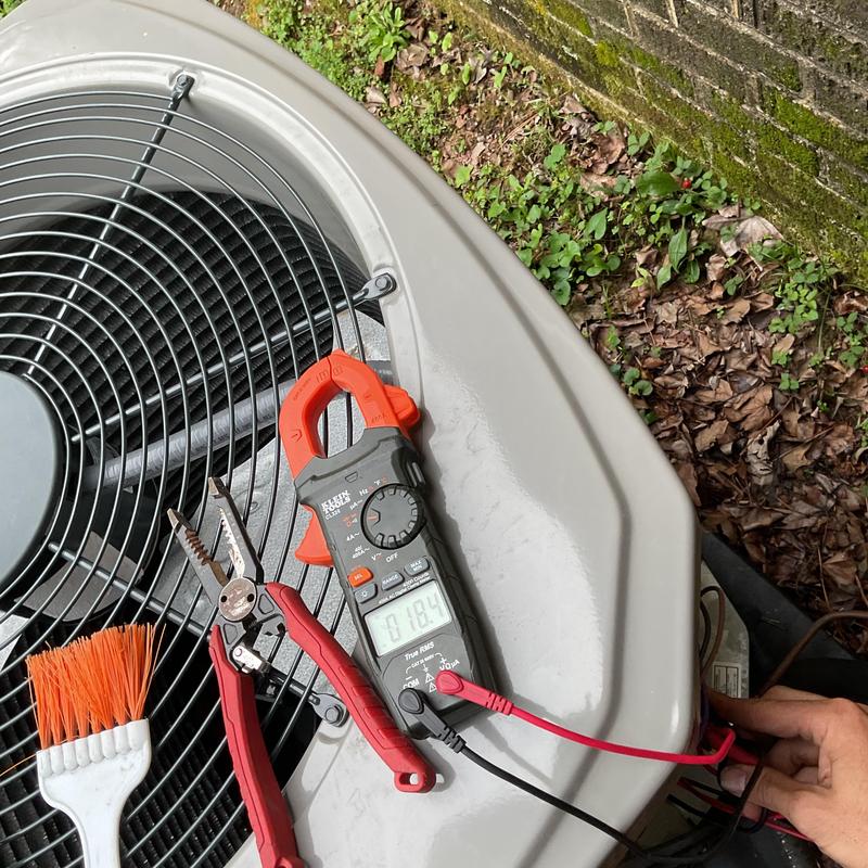Outdoor air conditioner electrical testing with multimeter