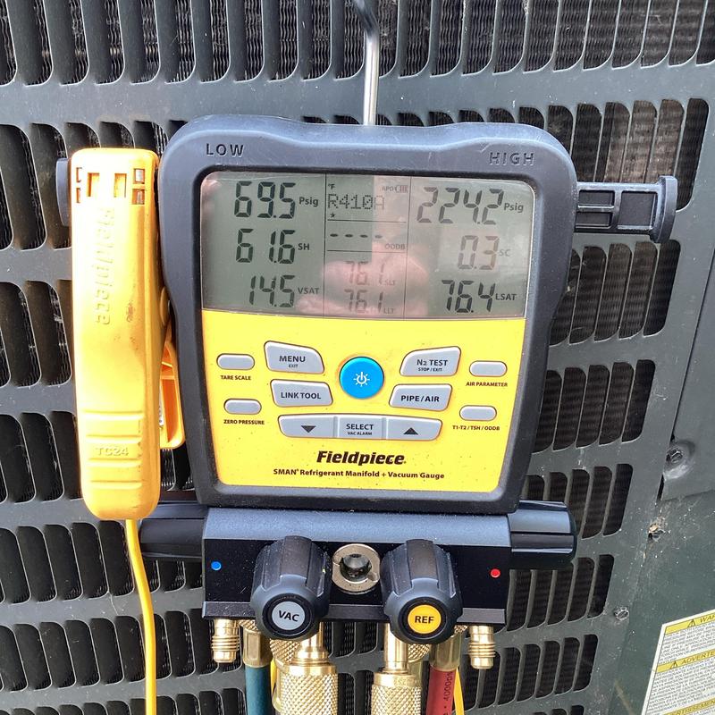 Refrigerant manifold gauge measuring A/C system pressures Refrigerant manifold gauge measuring A/C system pressures