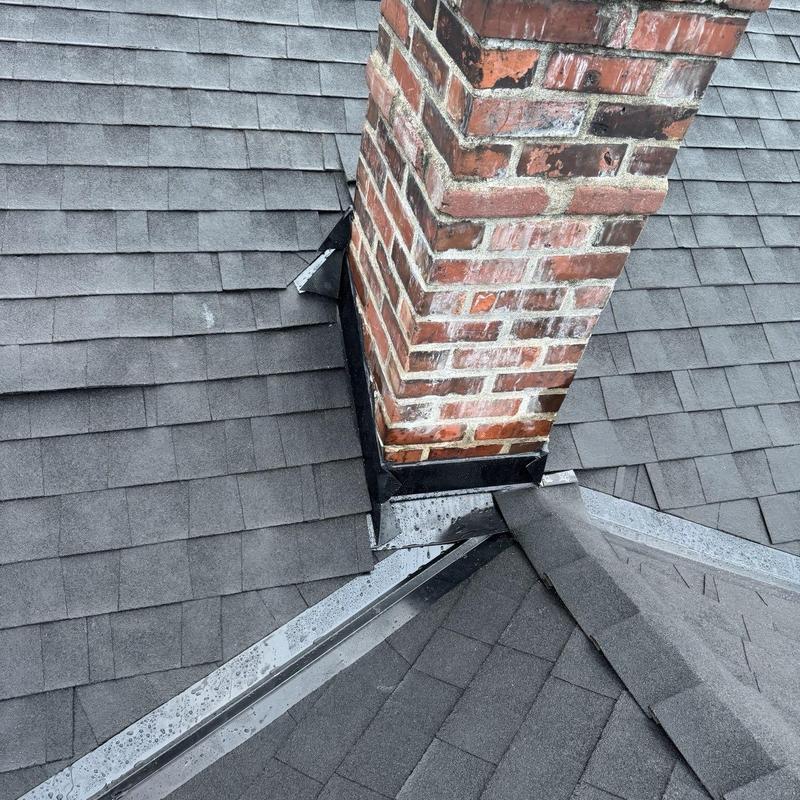 Chimney flashing on asphalt shingle roof