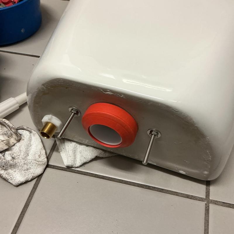 Toilet tank with new flush valve seal installed Toilet tank with new flush valve seal installed