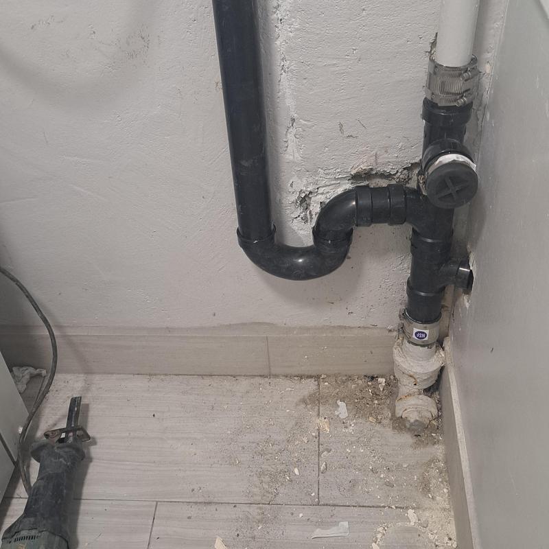 Laundry drain pipe with cast iron epoxy liner installation