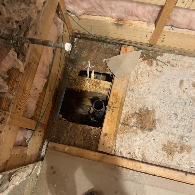 Floor drain pipe installation in shower remodel site Floor drain pipe installation in shower remodel site