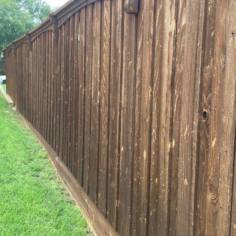 Wooden fence with fresh stain in Plano, TX