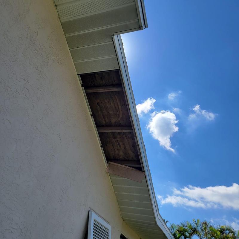 Missing soffit panel on home exterior roof edge