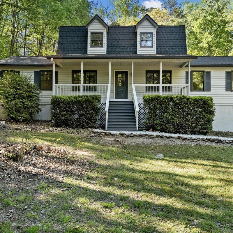 Asphalt shingle roof on residential home in wooded area