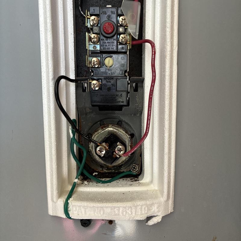 Water heater thermostat and wiring close-up in Corsicana