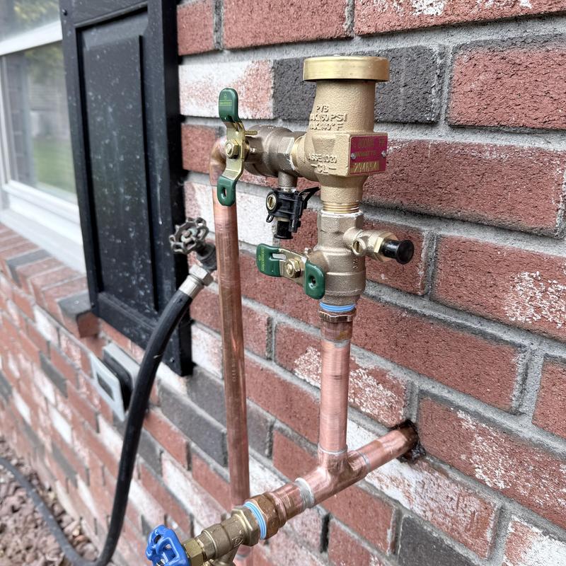 Backflow preventer on irrigation line with copper piping Backflow preventer on irrigation line with copper piping
