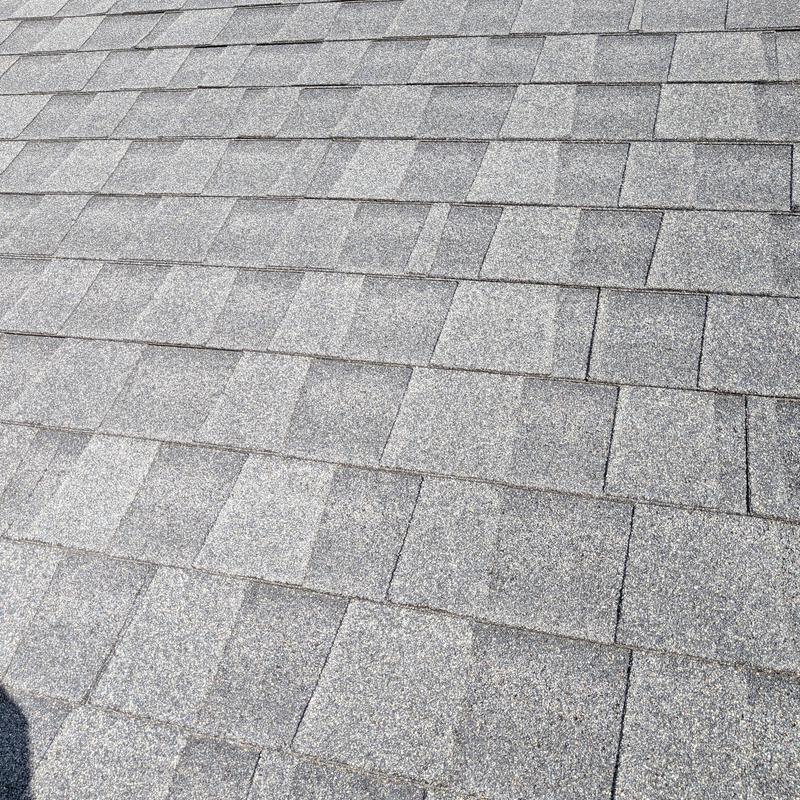 Charcoal GAF asphalt shingles roof surface close-up