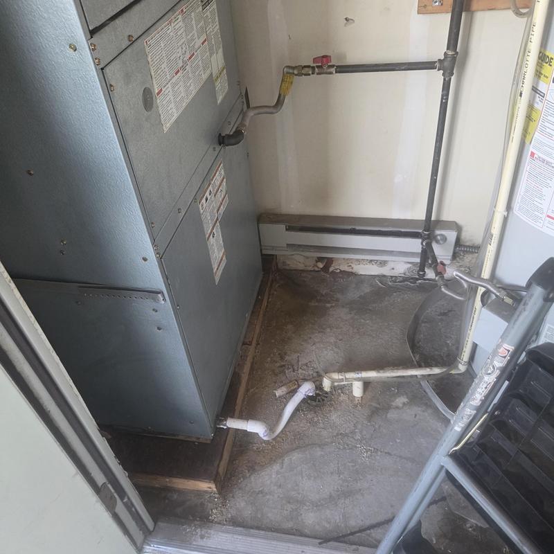 Furnace and piping setup in utility room