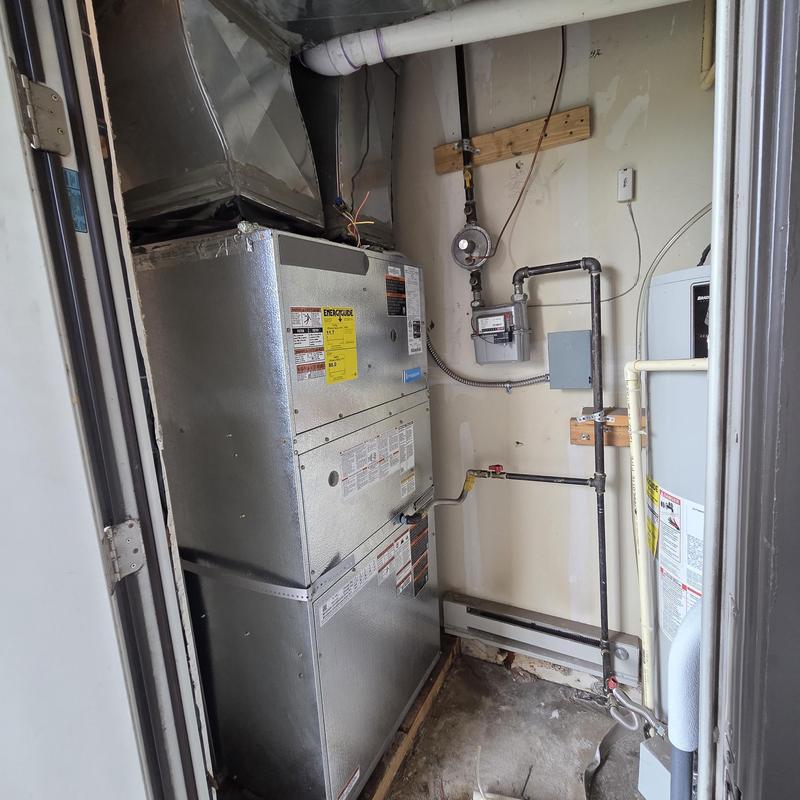 Furnace unit with gas piping and ductwork in utility room