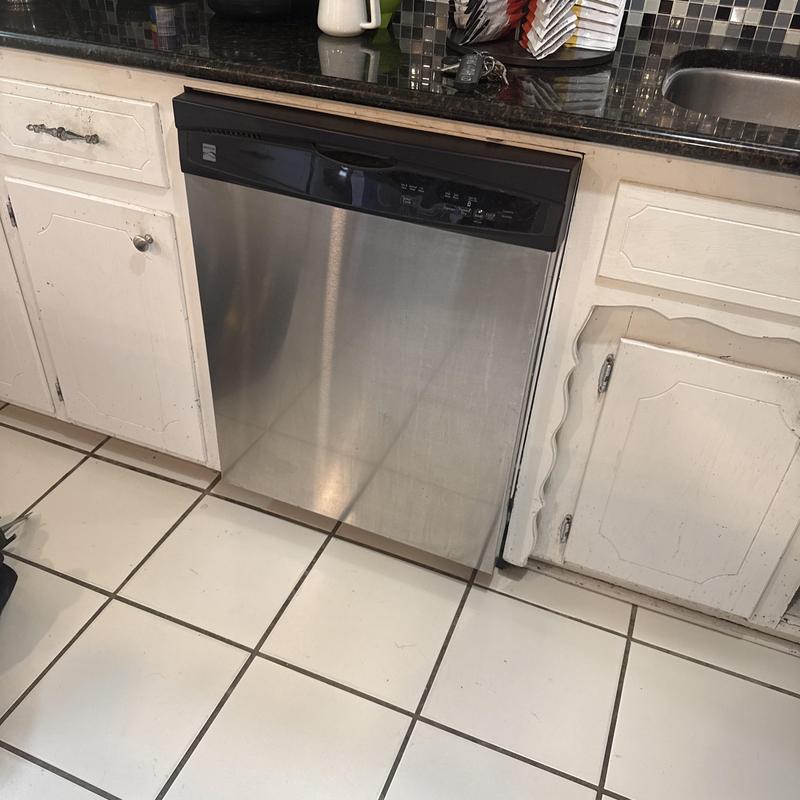 Dishwasher installation with proper fitting in kitchen