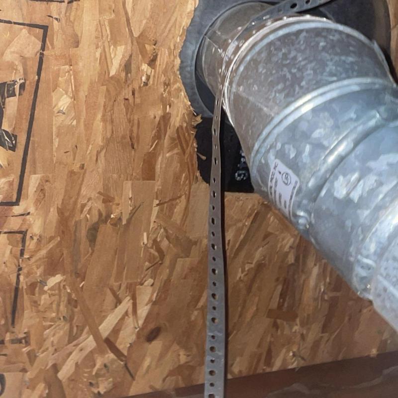 Furnace vent pipe with metal flashing and support strap