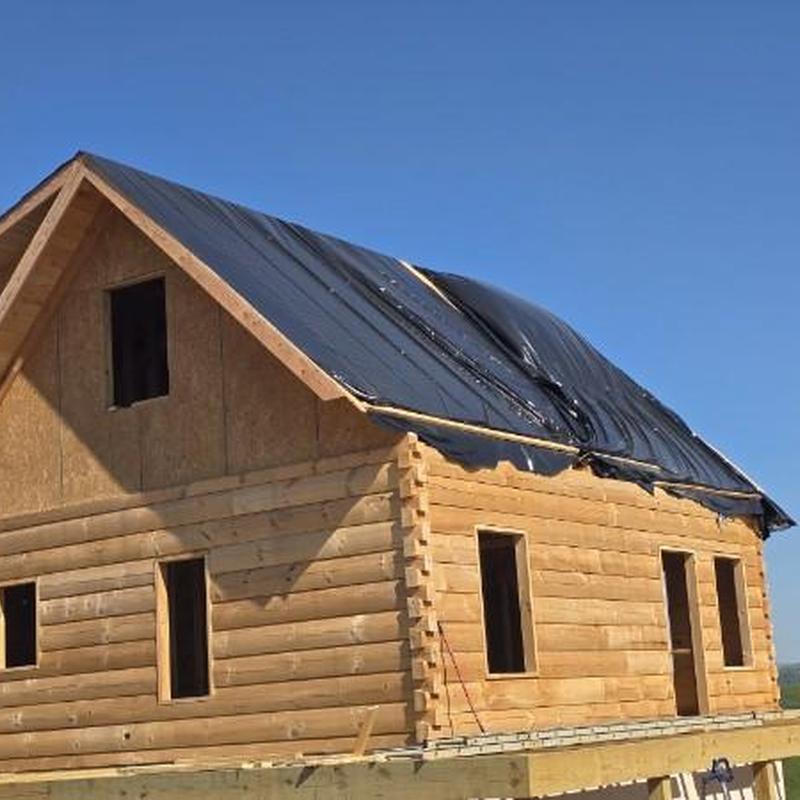 Standing seam metal roof underlayment on log home Standing seam metal roof underlayment on log home