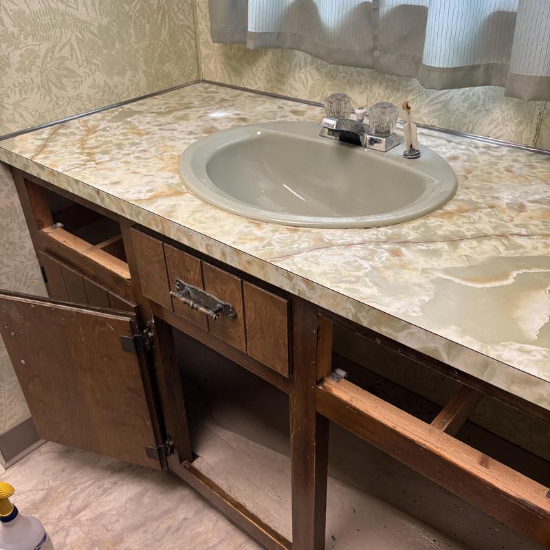 Lavatory sink and countertop with open cabinet below