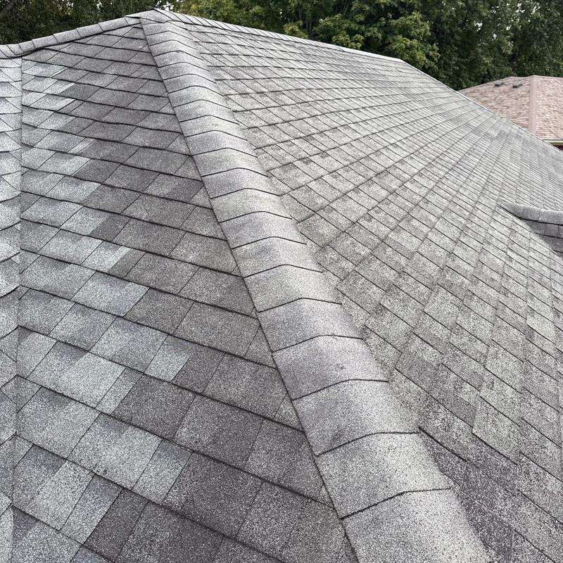 Asphalt shingle roof with hail damage inspection