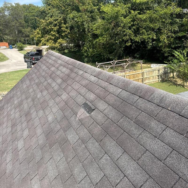 Roof shingles with hail damage and missing granules