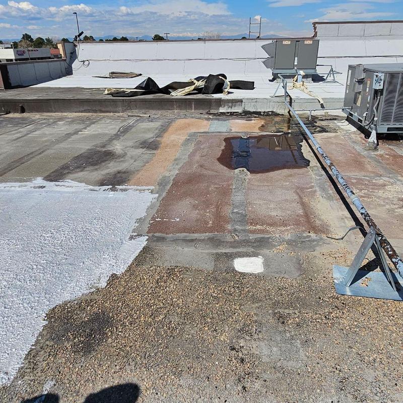 Modified torch-down flat roof with damaged seams