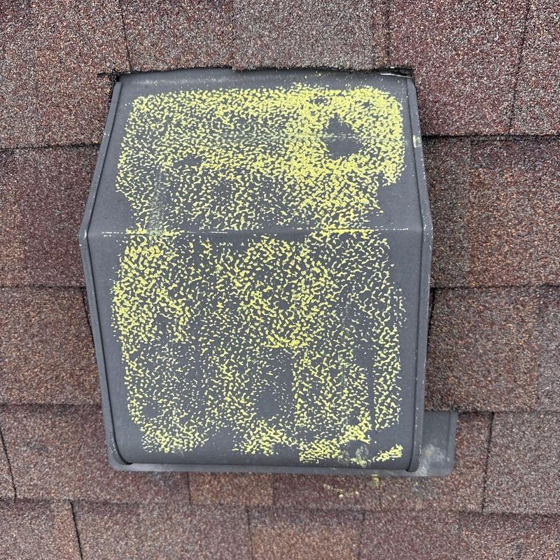 Roof vent with hail damage marked in yellow