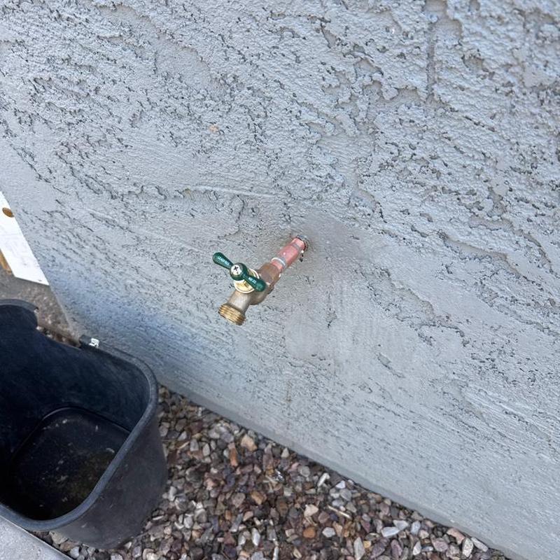Sweat hose bib with copper pipe extension on stucco wall